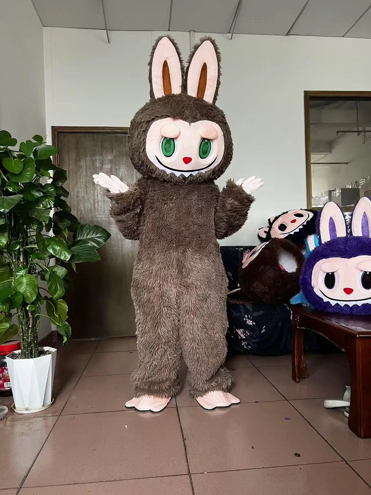 Zoomies & Co adorable brown bunny mascot costume with oversized head and fluffy body for fun events