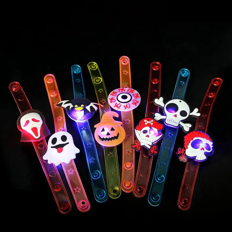 Colorful Halloween party bracelets and rings with spooky designs including ghosts and skulls