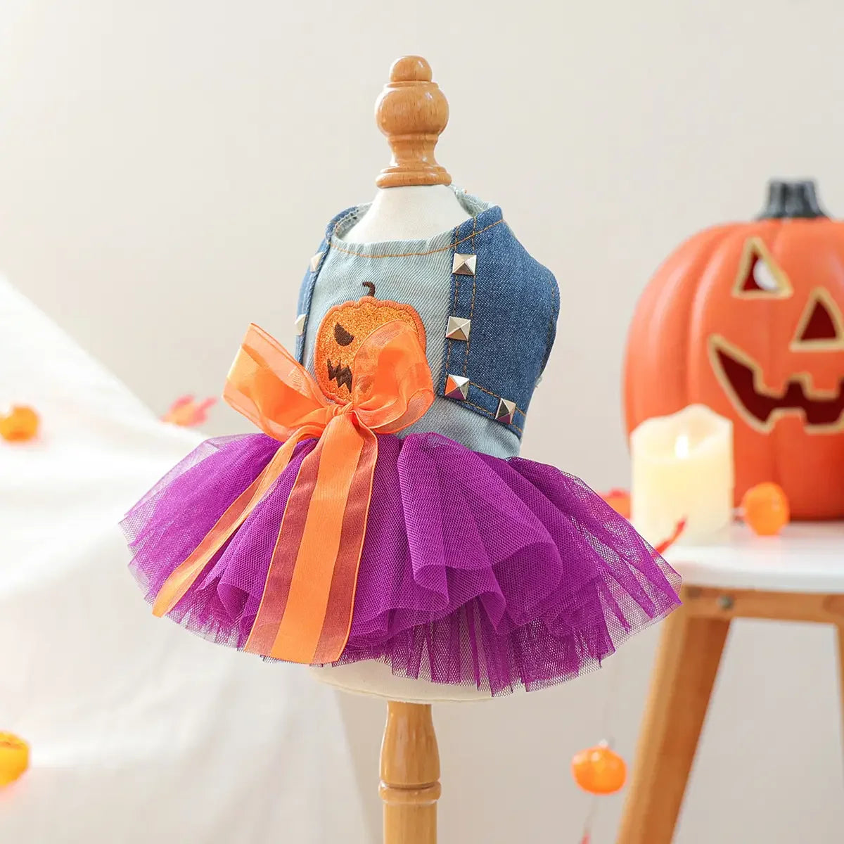 Adorable denim top with a purple tulle skirt and pumpkin detail, perfect for a cute Halloween pumpkin skirt for pets.
