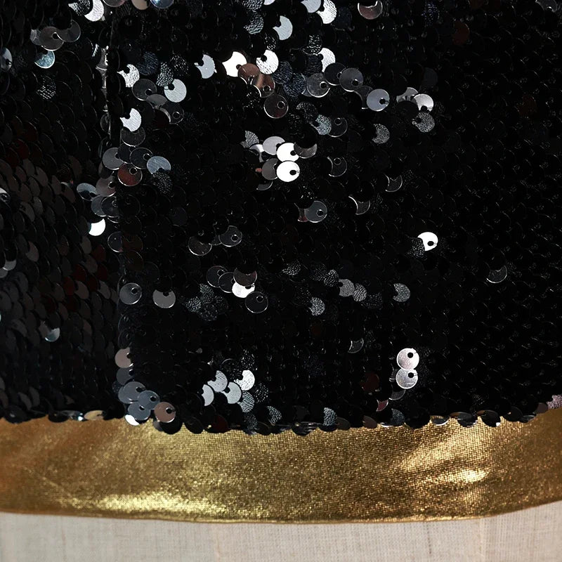 Close-up of black sequin fabric with gold trim for KPop demon hunter cosplay costume for girls