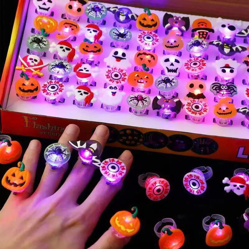 Colorful Halloween party bracelets and rings with glowing designs for festive gatherings