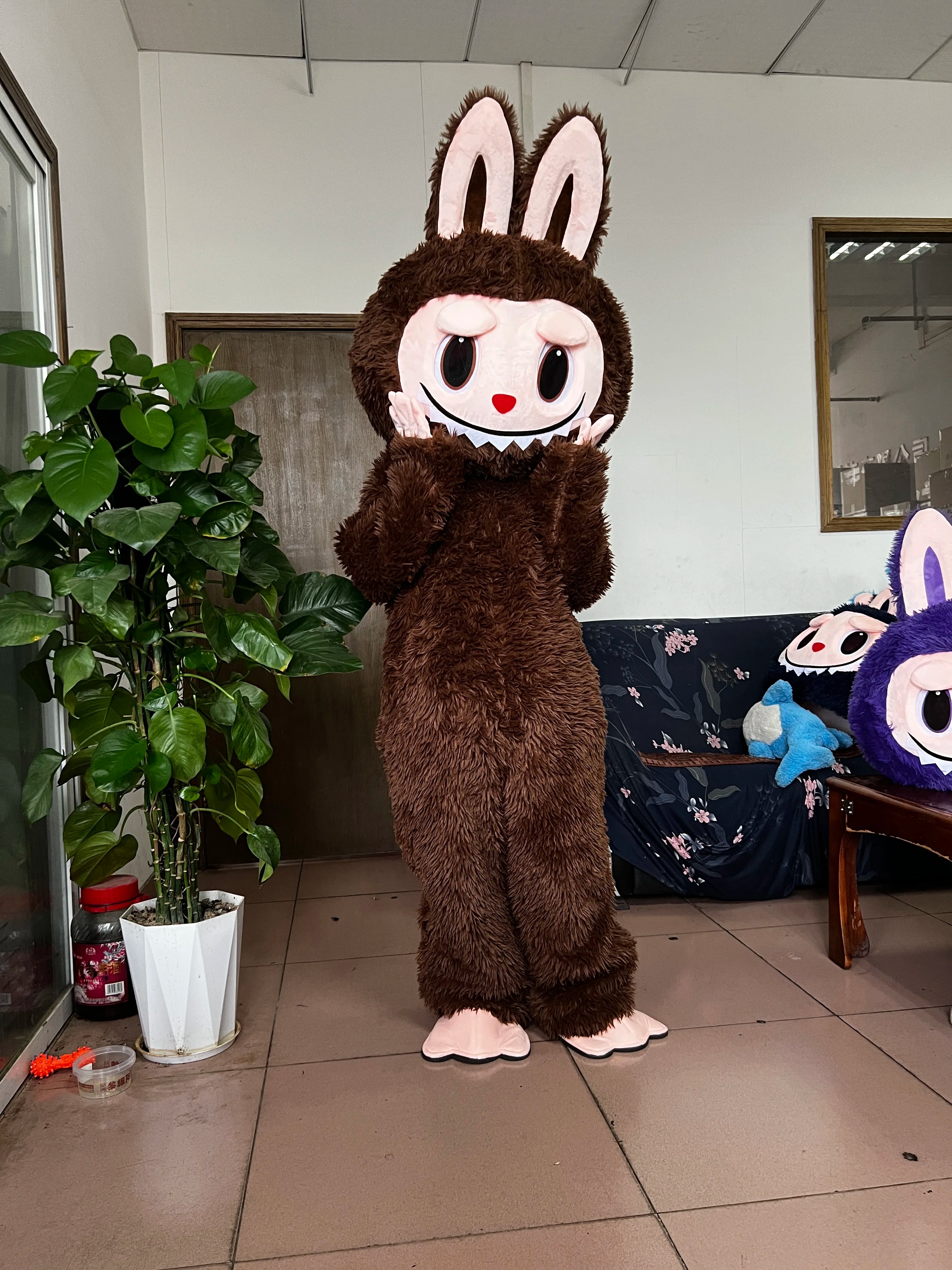 Brown bunny costume from Zoomies & Co featuring a playful character design with oversized head and fluffy body