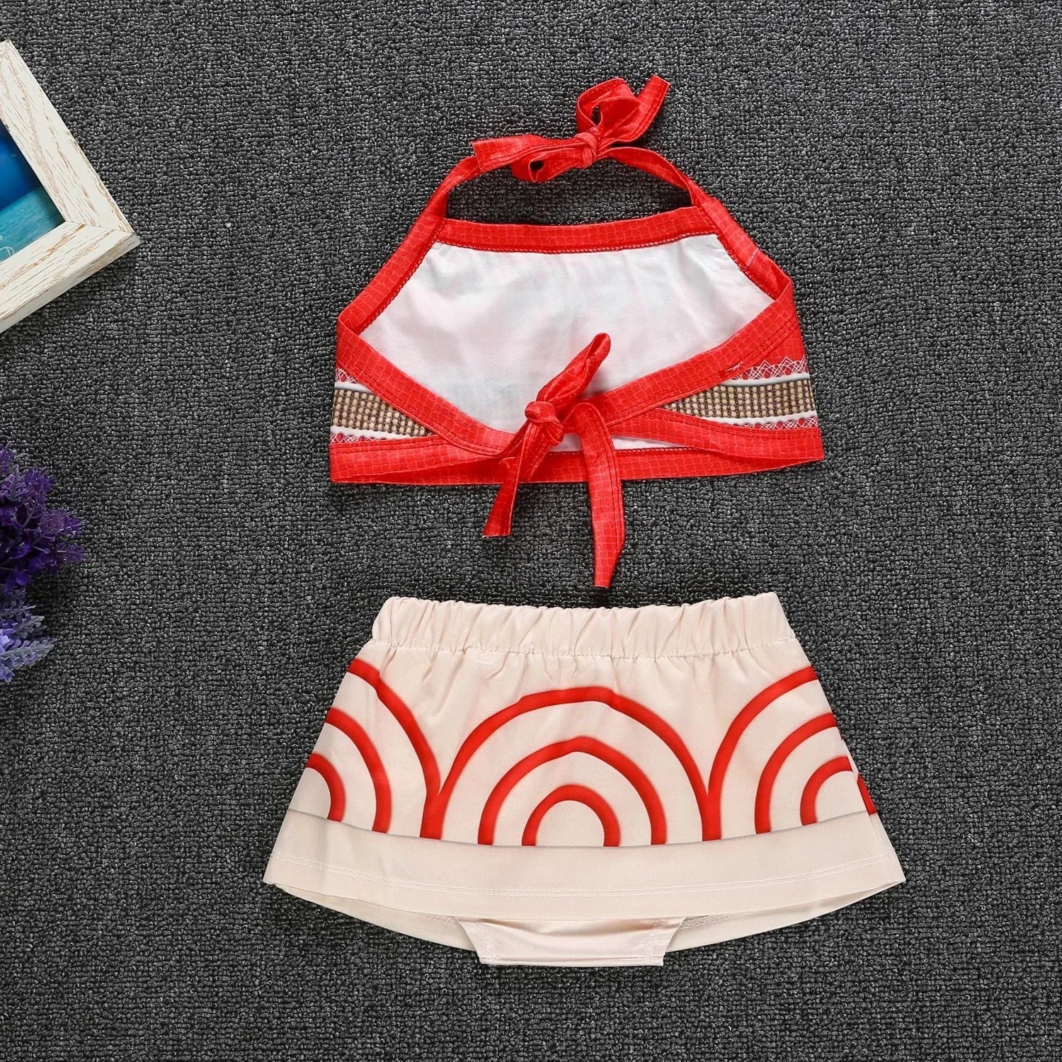 Moana costume for little girls with a red top and patterned skirt for playtime adventures