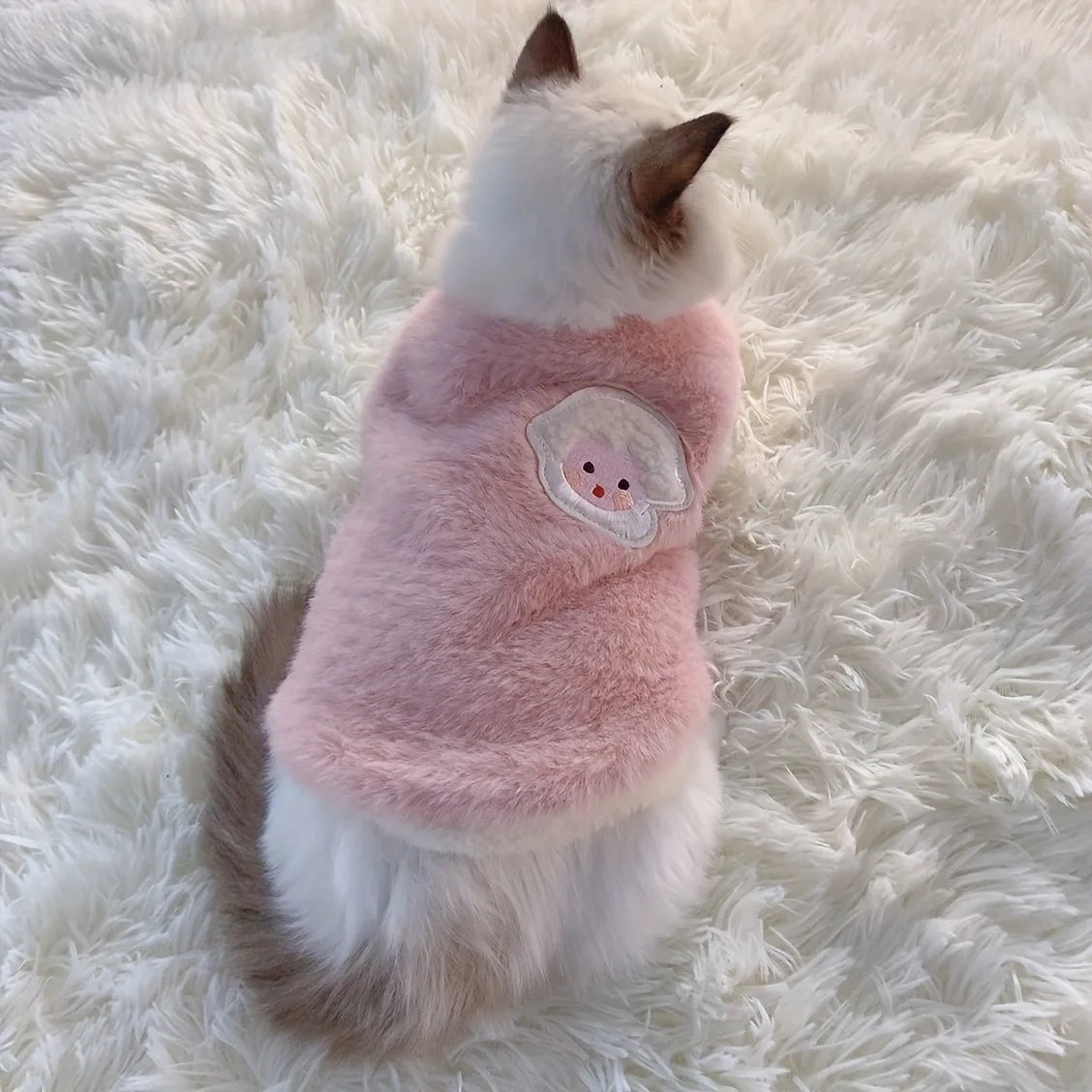Cute pink soft fleece cat vest for winter with a snowman design on the back
