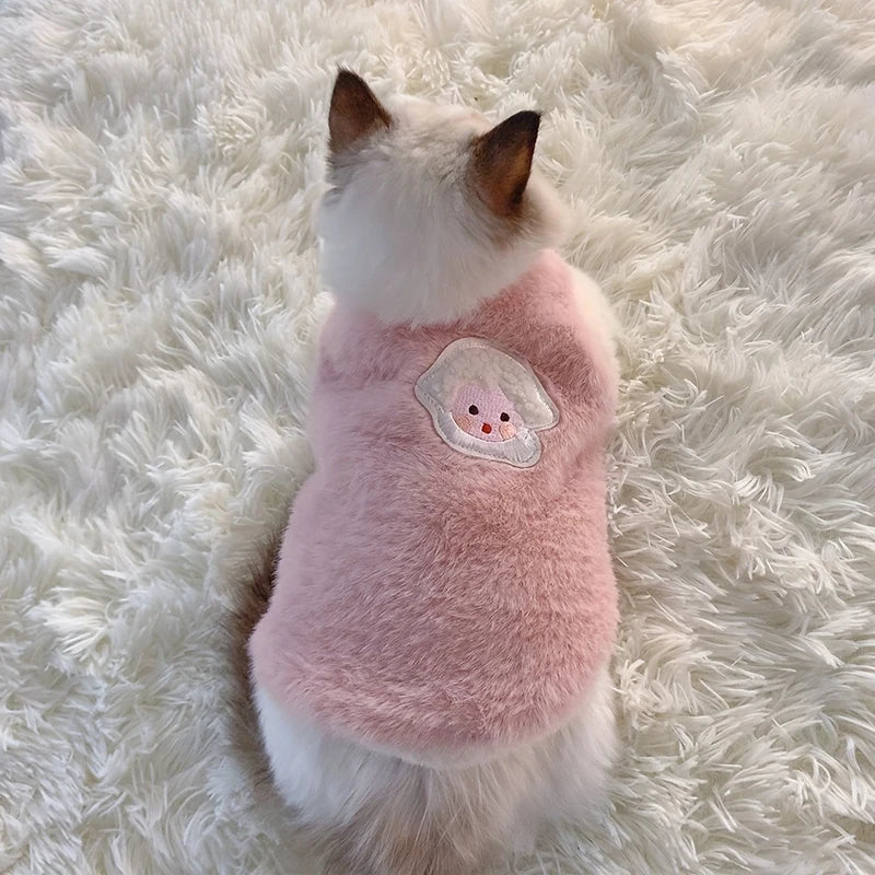 Adorable soft fleece cat vest for winter in pink with a cute face patch on the back