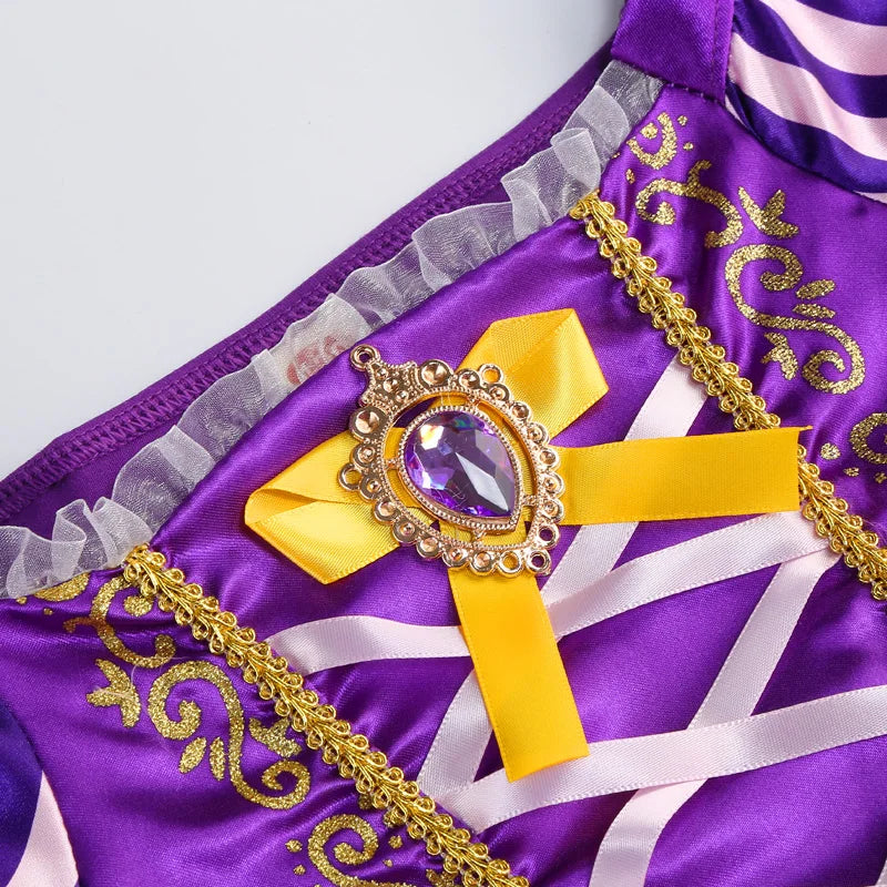 Detail of the Disney Rapunzel Costume Dress featuring purple fabric and decorative gold accents