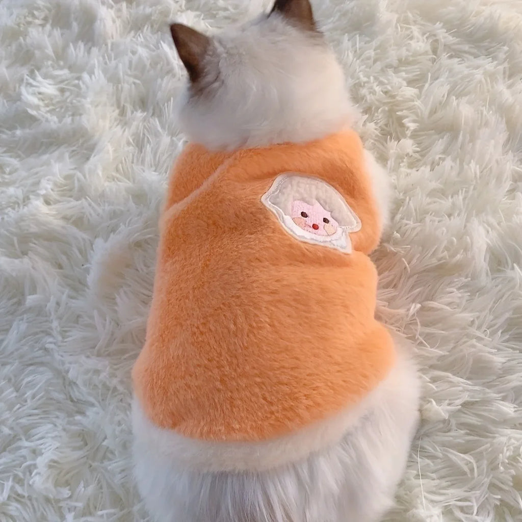 Soft fleece cat vest for winter in orange with a cute design on the back
