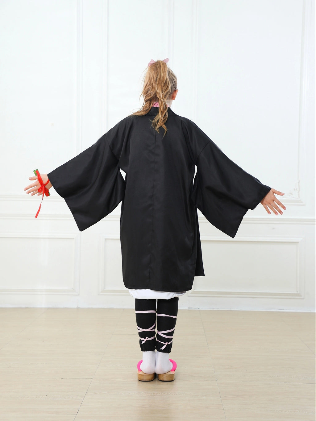 Back view of a black anime kimono cosplay costume with wide sleeves for cosplay events