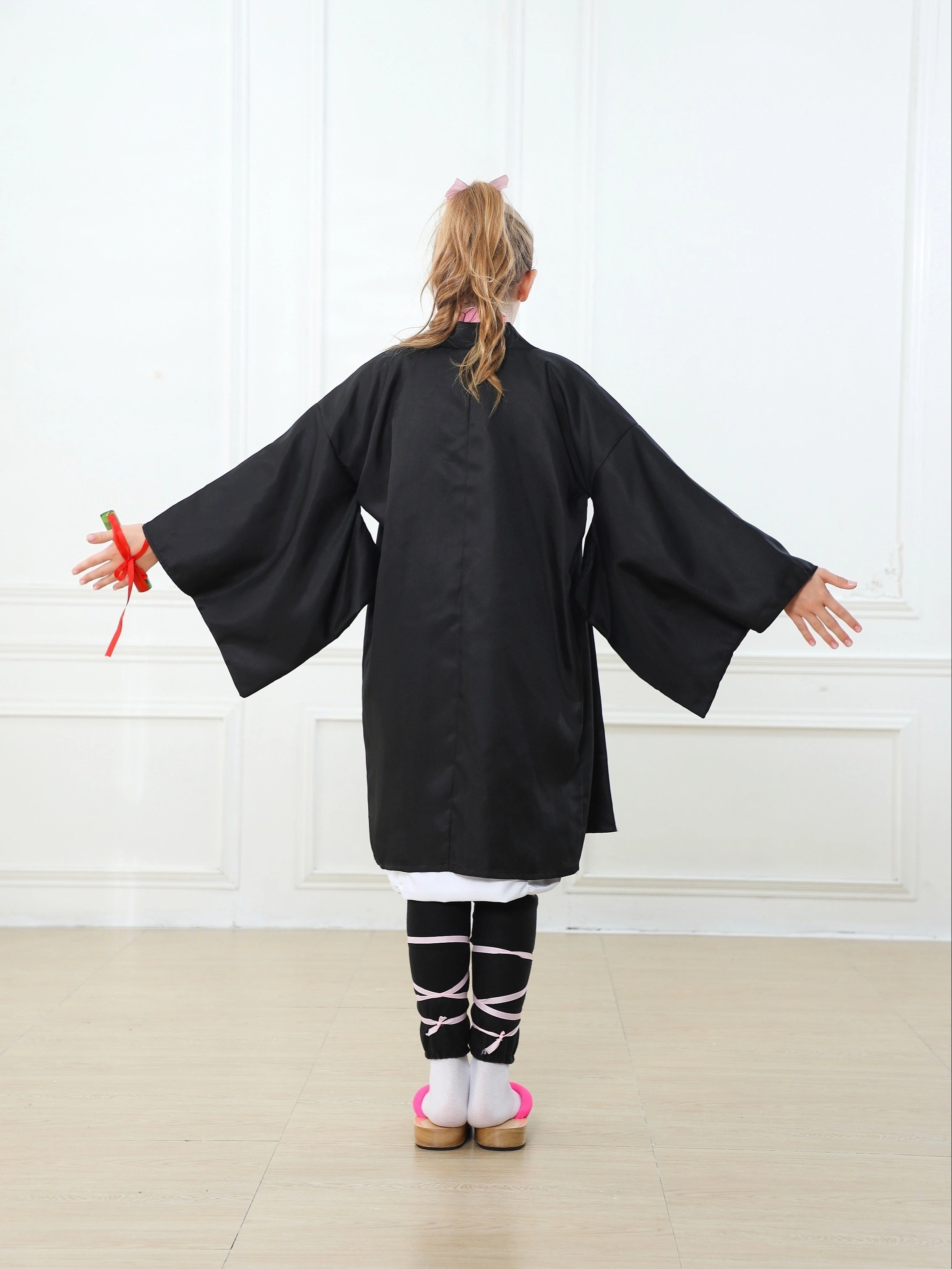 Back view of a black anime kimono cosplay costume with wide sleeves for cosplay events
