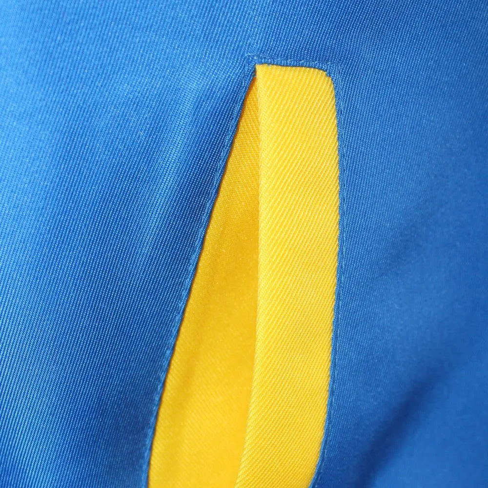 Close-up of Ash Pokemon costume with accessories featuring blue and yellow fabric details