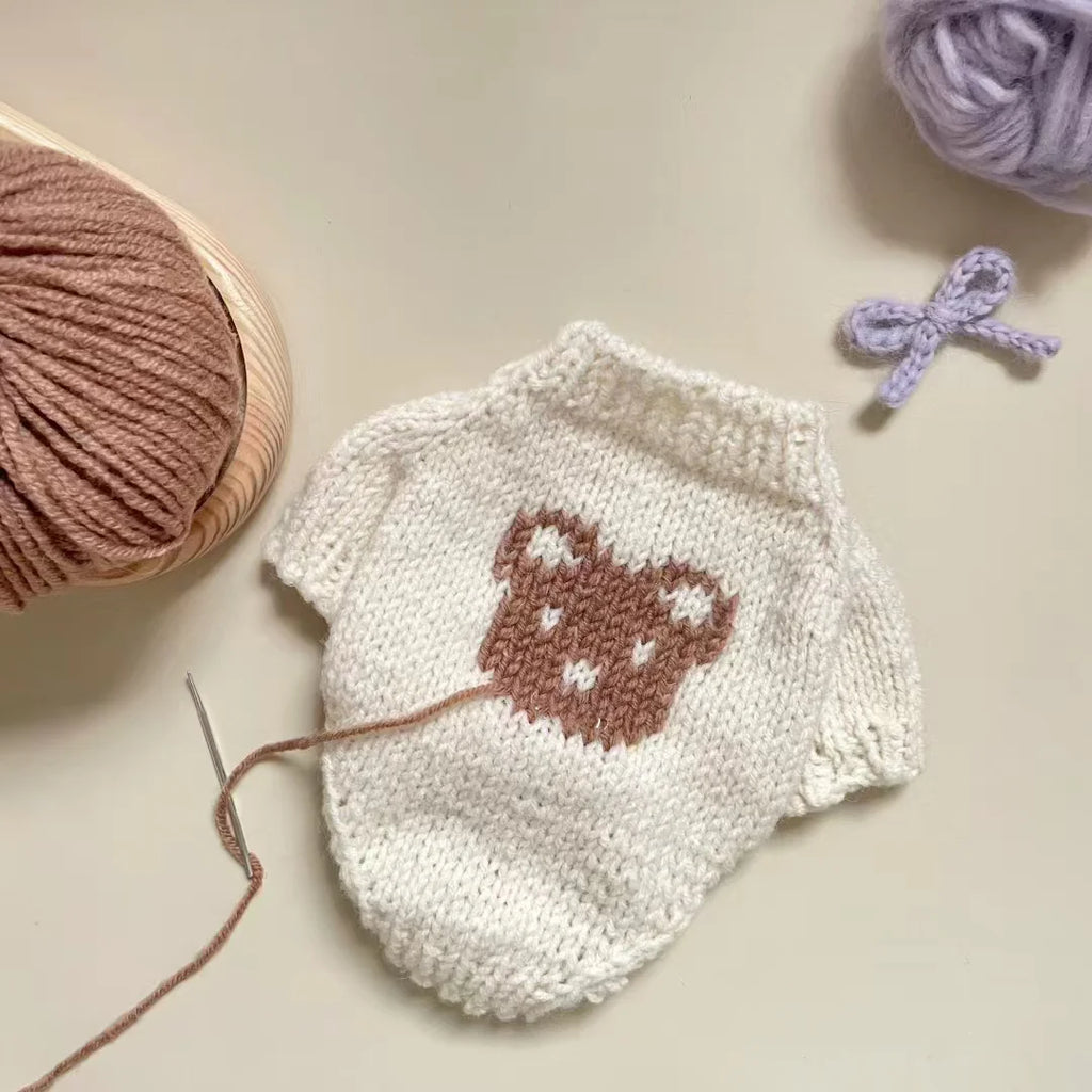Beige knit dog sweater with bear design, perfect for keeping your pet cozy and stylish