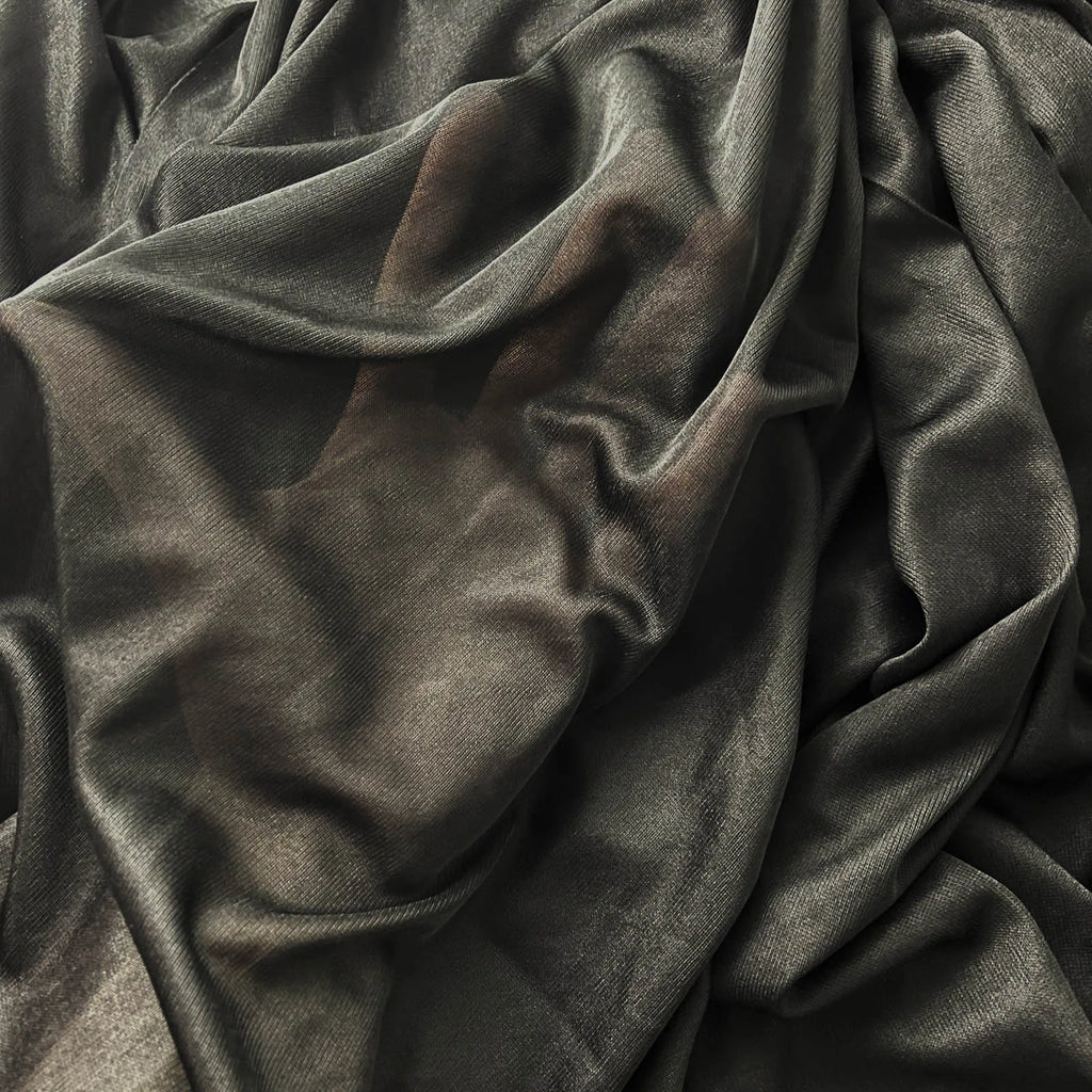Soft black cape robe Halloween costume fabric draped elegantly for stylish spooky attire