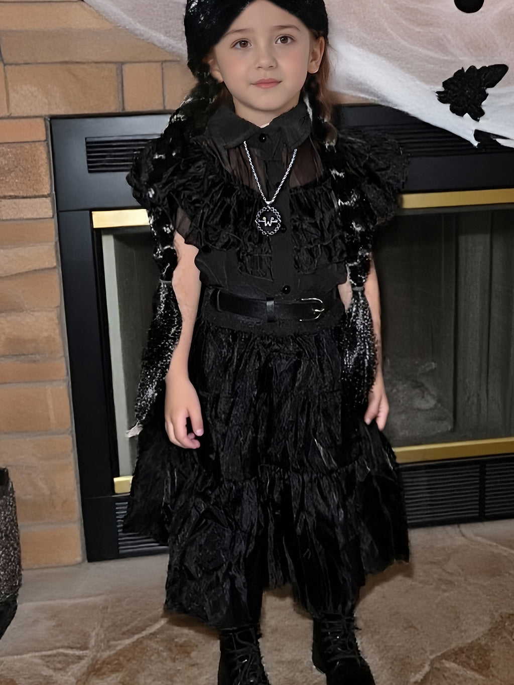 Black princess costume dress for girls featuring ruffled layers and stylish accessories