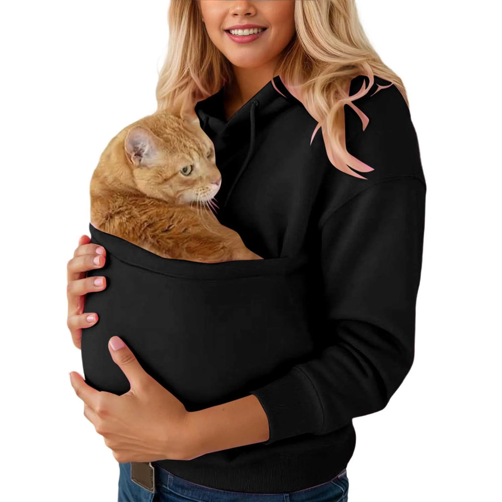 Woman wearing a cat carrier kangaroo pocket sweatshirt with a cat comfortably nestled inside