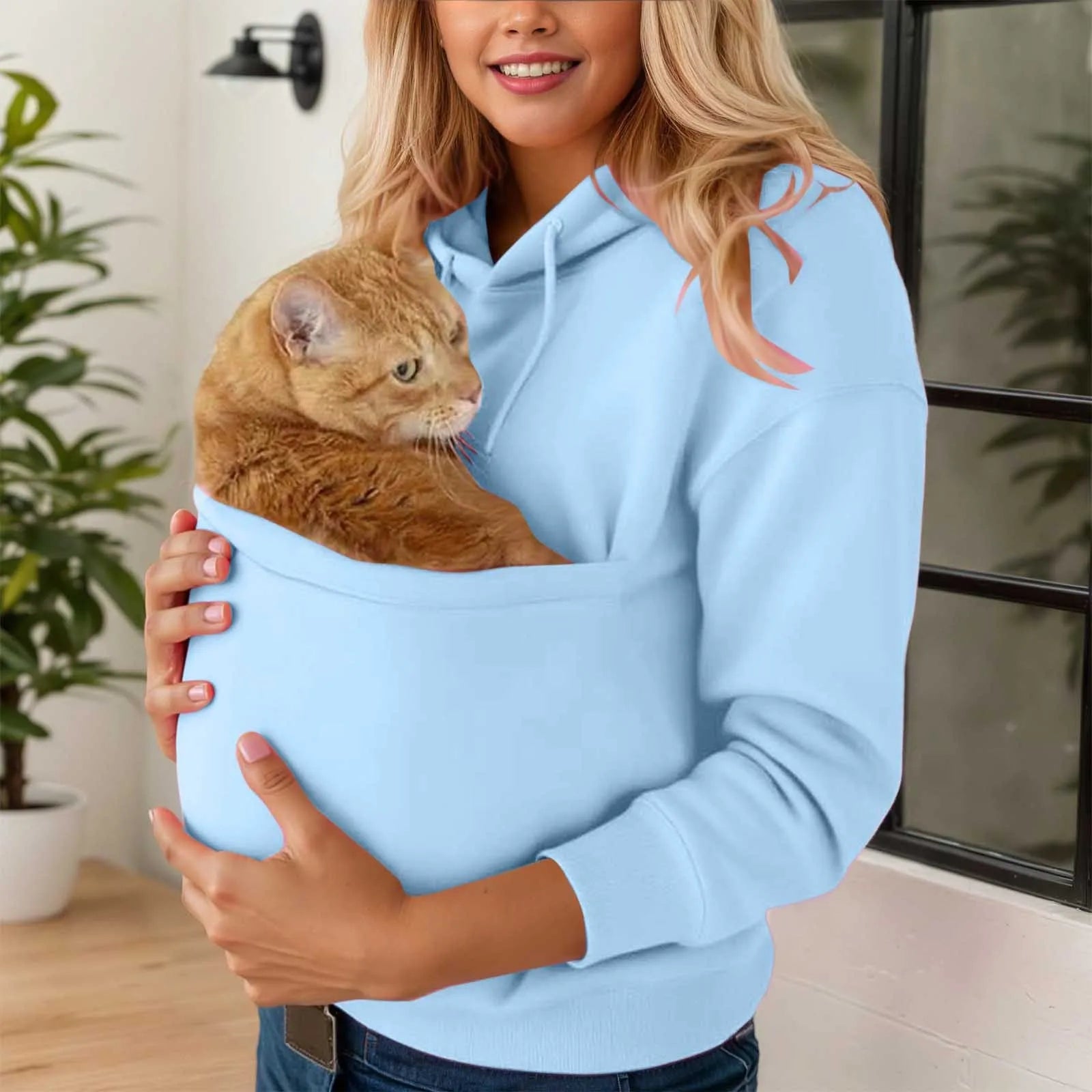 Blue cat carrier kangaroo pocket sweatshirt designed for pet owners to carry their cats comfortably