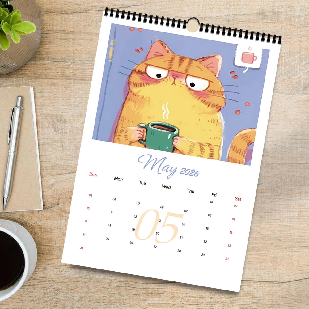 Cattitude wall calendar 2026 featuring a cat holding a coffee cup for each month