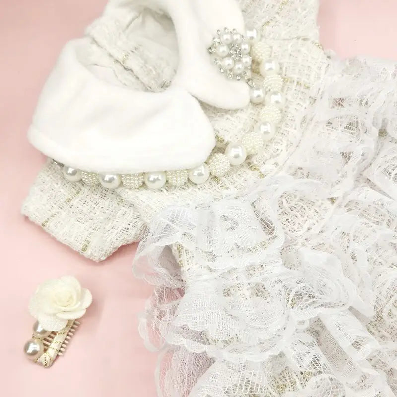 Elegant white Christmas pet dress for cats and dogs with ruffles and pearl details for festive celebrations