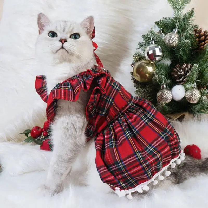 Adorable Christmas pet dress for cats and dogs in red plaid with ruffles and pom-pom trim