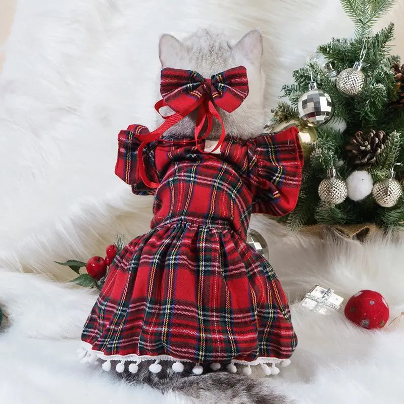Adorable red plaid Christmas pet dress for cats and dogs with bow and pom-pom details