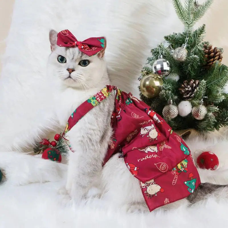 Adorable Christmas pet dress for cats and dogs in red with festive patterns and a matching bow