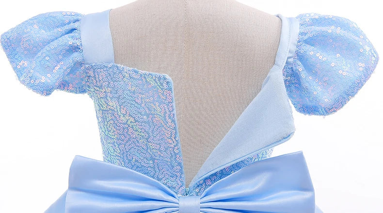 Back view of a Cinderella princess dress for girls featuring shimmering blue fabric and a large bow