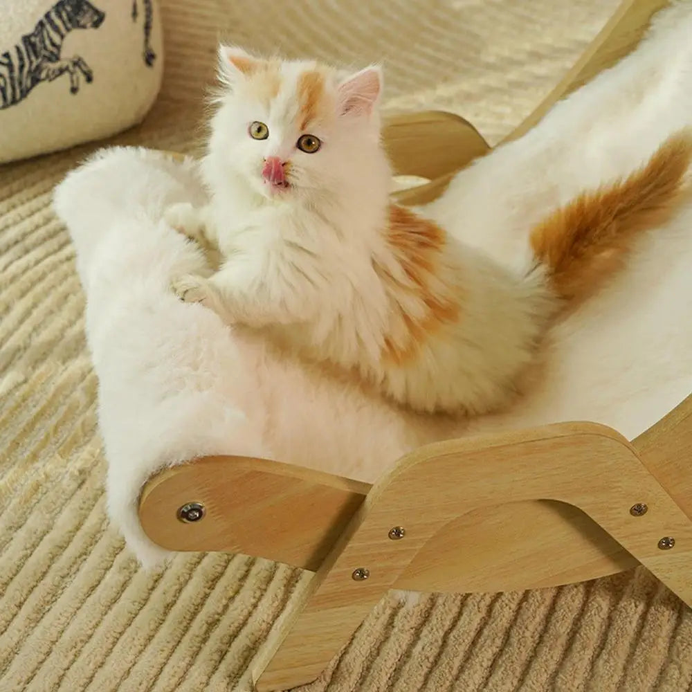 Fluffy cat lounging comfortably on the CloudPaw Plush Cat Lounge Chair with soft cushion and wooden frame