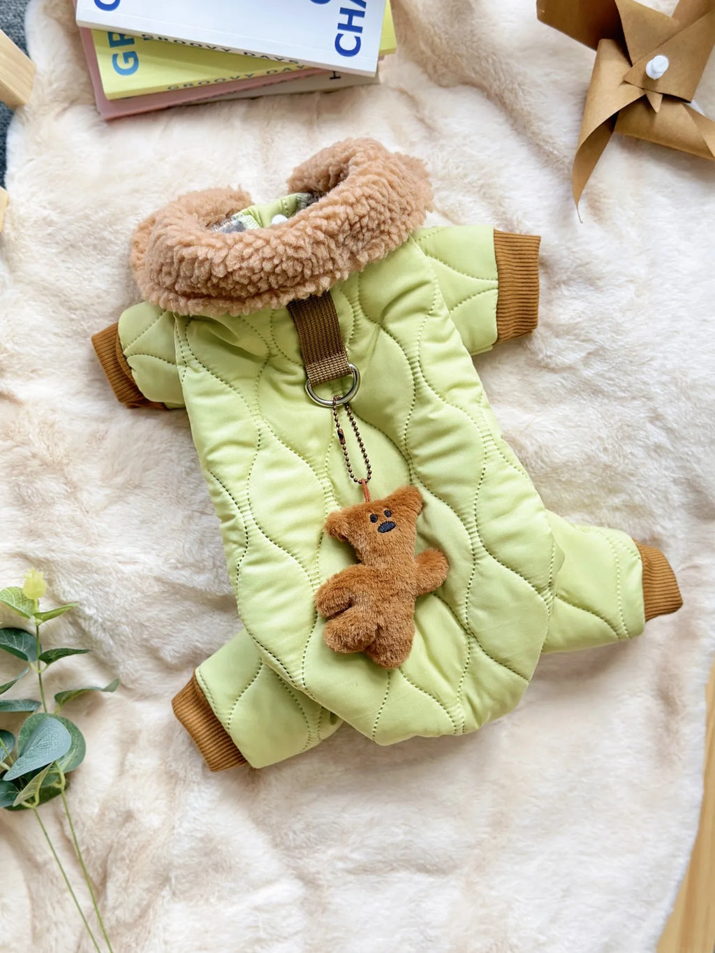 Cute dog pajamas with plush accessory in light green with a fluffy collar and teddy bear charm.