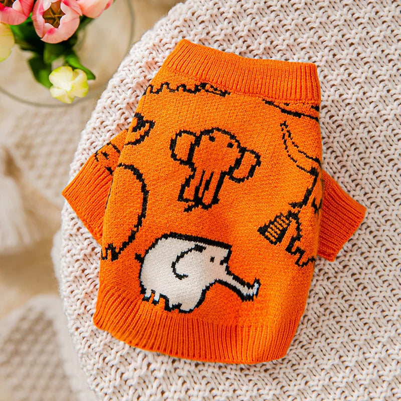 Cute knitted dog coat for winter in orange with playful elephant pattern for stylish pups