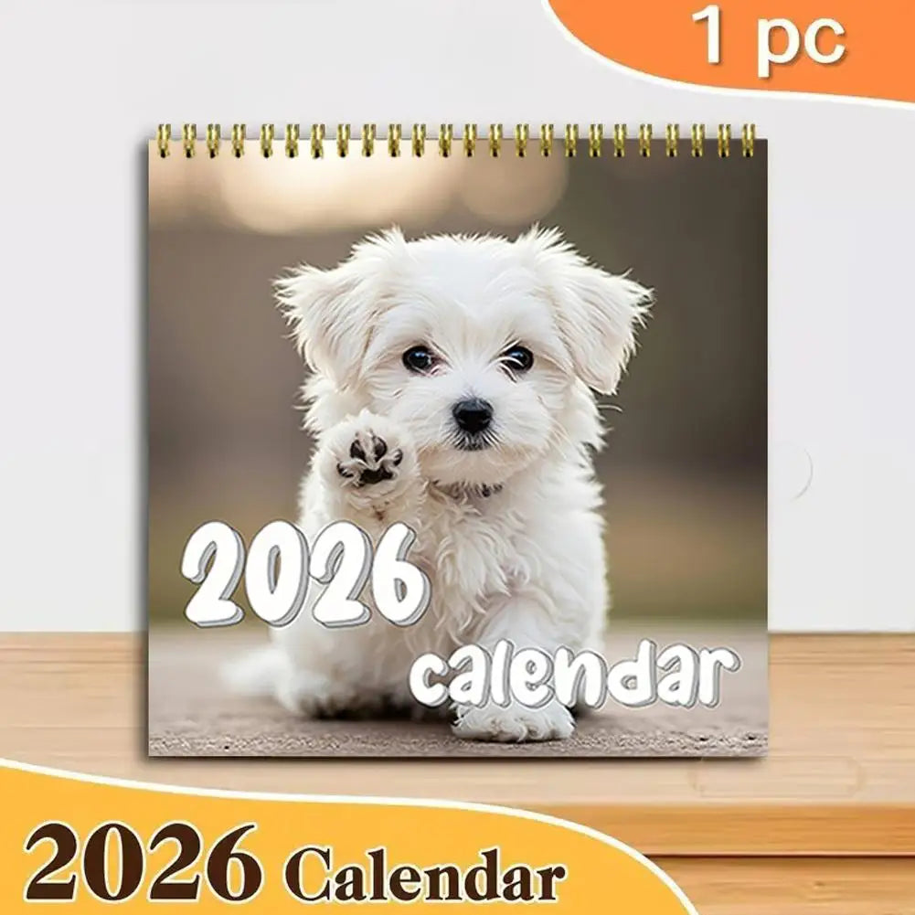 Cute puppy wall calendar 2026 featuring an adorable white puppy on the cover page