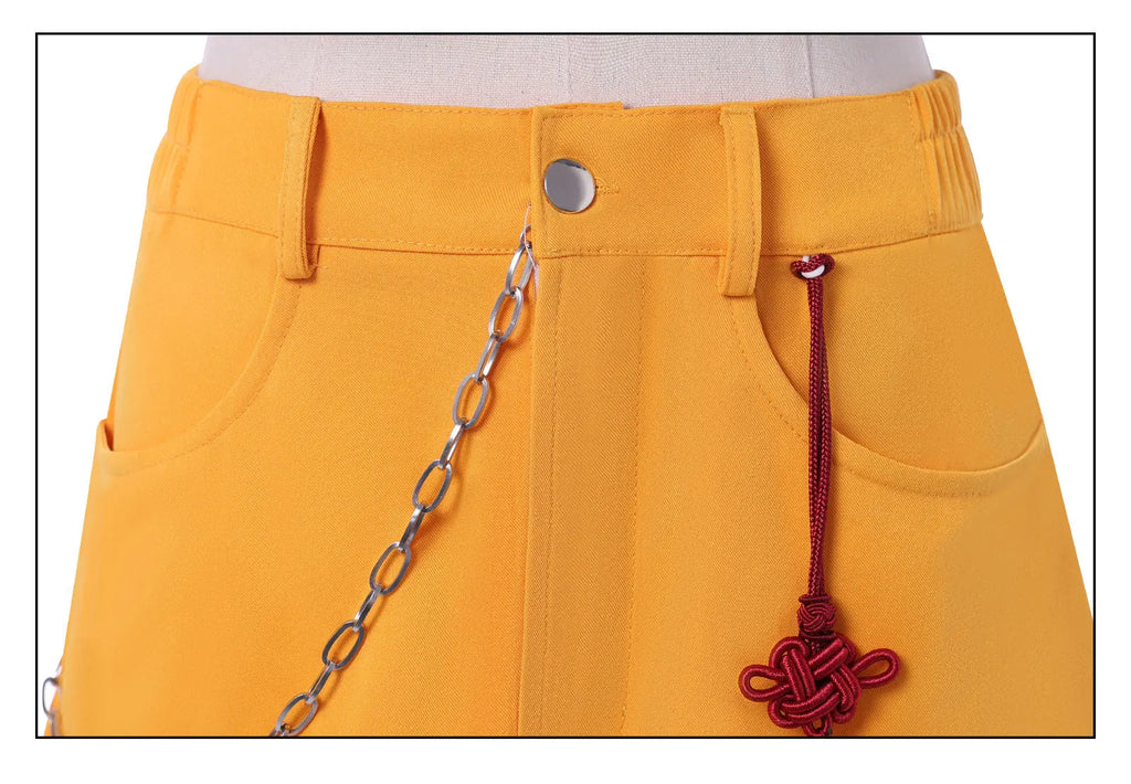 Close-up of yellow skirt detail from Demon Hunter Superstar costume for women featuring chain and charm
