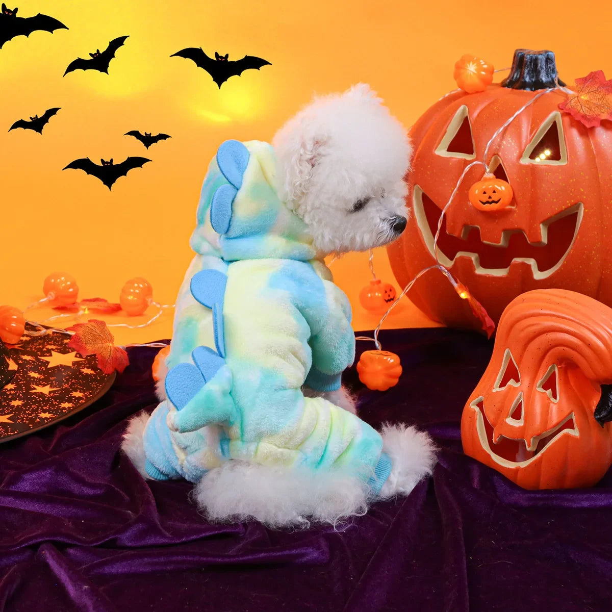 Cute dog wearing a dinosaur dog costume hoodie with colorful spikes, perfect for Halloween fun