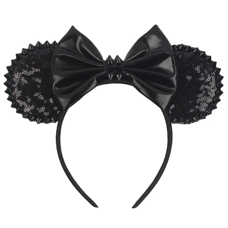 Disney Halloween ear headband featuring black sequins and a large bow for festive celebrations