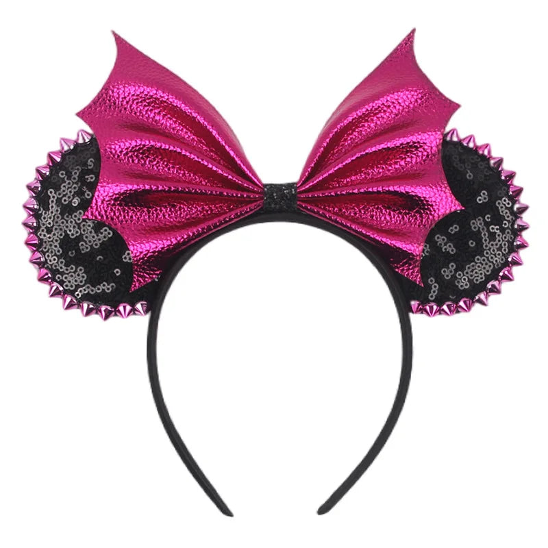 Disney Halloween ear headband with shiny pink bow and black sequined accents for festive celebrations