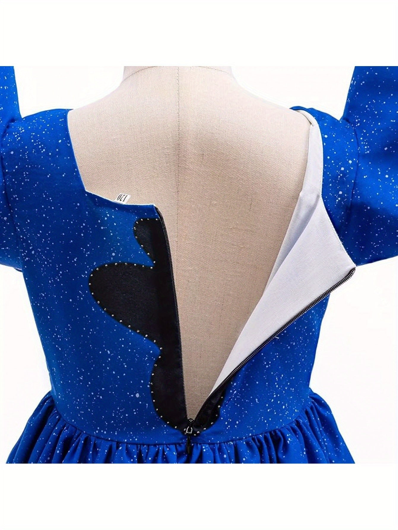 Back view of Disney Stitch girls costume showcasing zipper and blue starry fabric