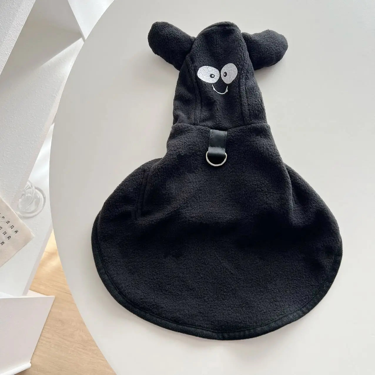 Dog Halloween ghost cape from Zoomies & Co featuring a friendly ghost design with ear attachments
