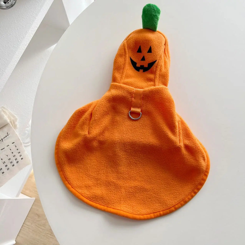 Cozy orange pumpkin costume for dogs featuring a ghost cape for Halloween festivities