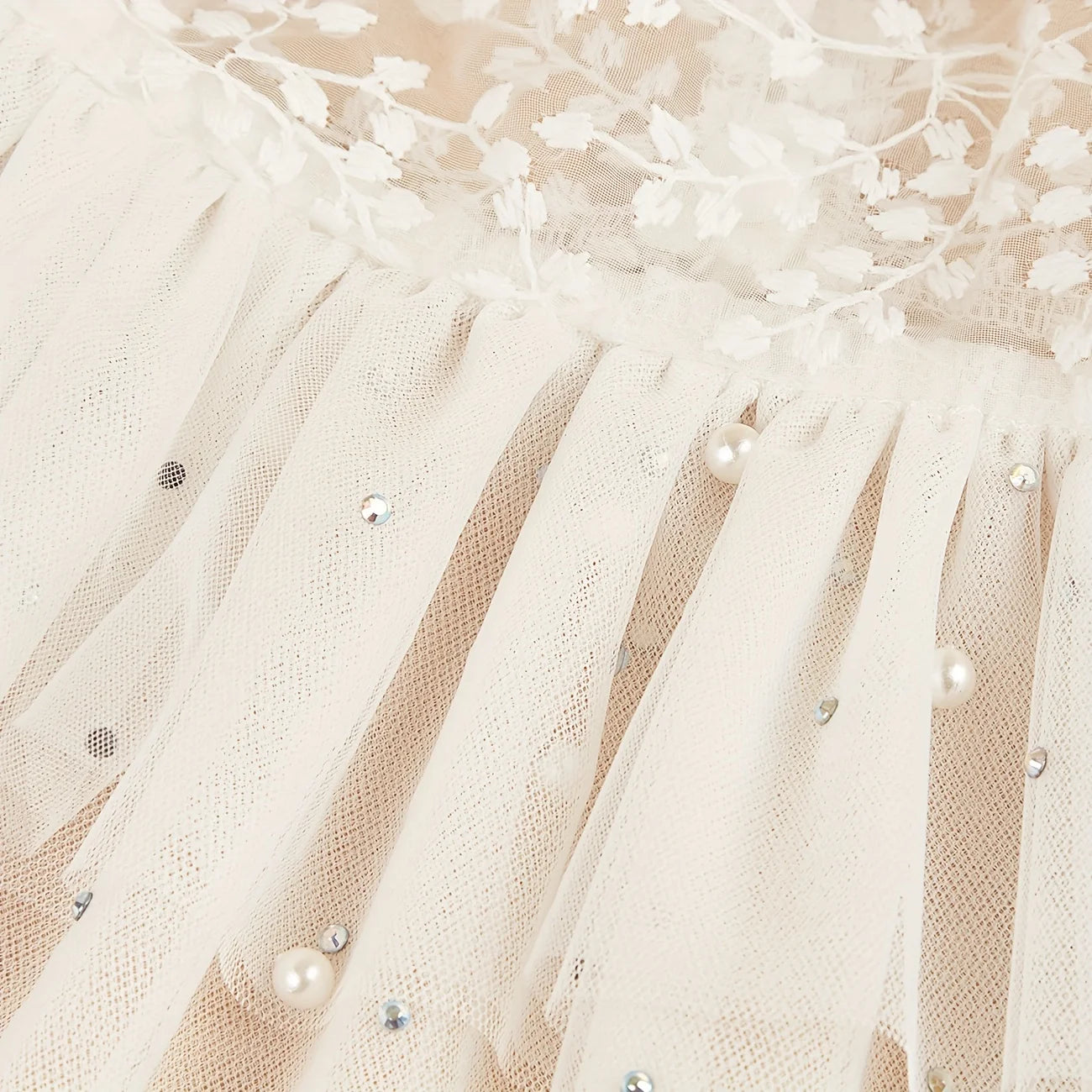Elegant dog wedding dress featuring lace and tulle with decorative sequins for special occasions