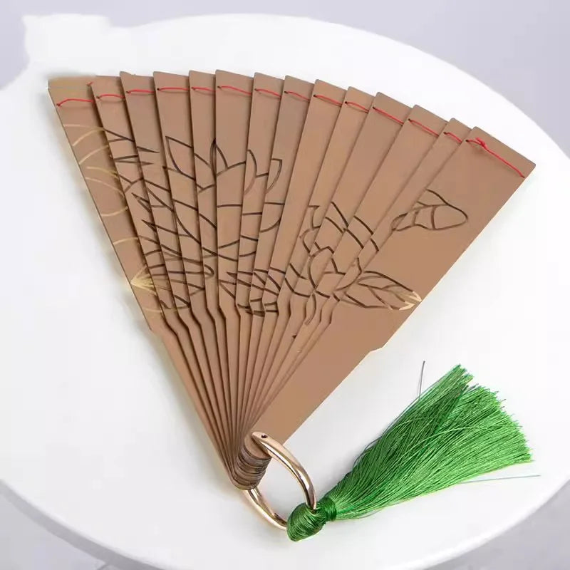 Douma cosplay folding fan with floral design and green tassel, perfect for anime fans