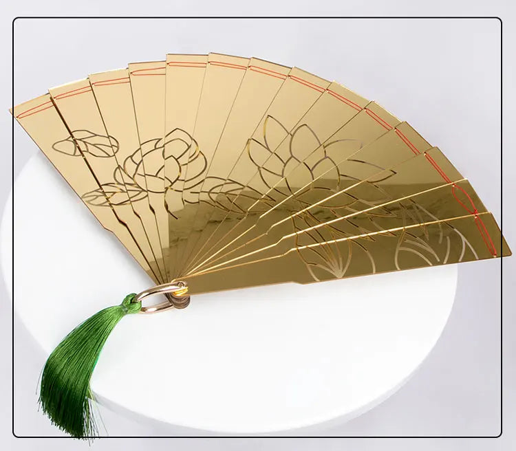 Douma cosplay folding fan with elegant gold design and green tassel for stylish anime enthusiasts
