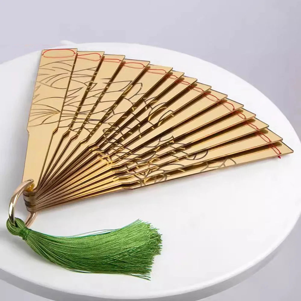 Elegant Douma cosplay folding fan with intricate design and green tassel for anime enthusiasts