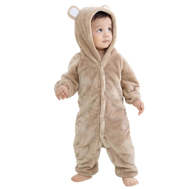 Cute toddler in a soft brown elephant baby romper costume with a hood and ears