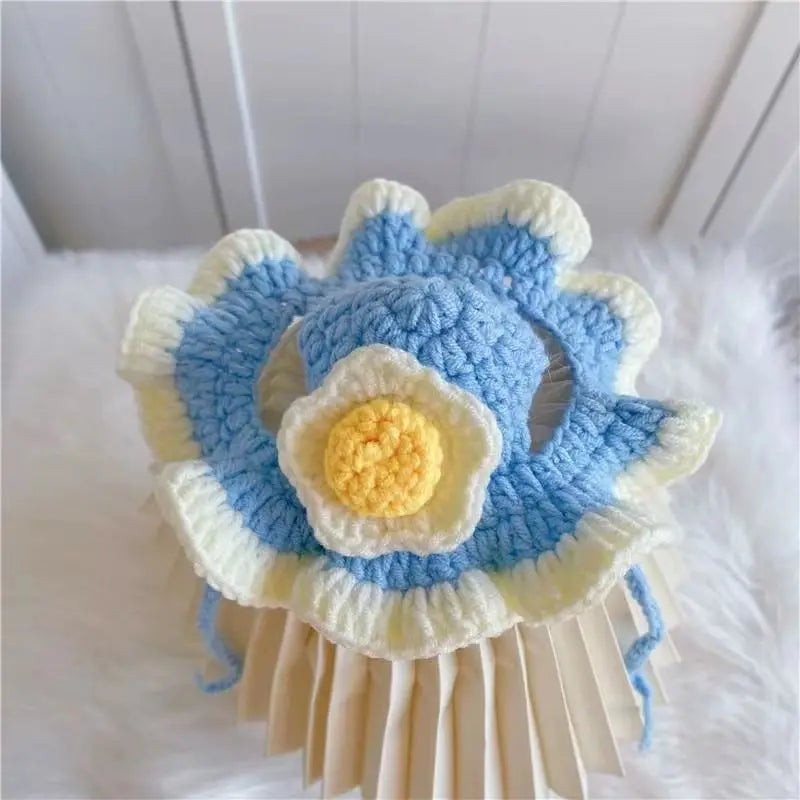 Cute blue and yellow crocheted flower pet hat, perfect for funny pet hats for cats and dogs