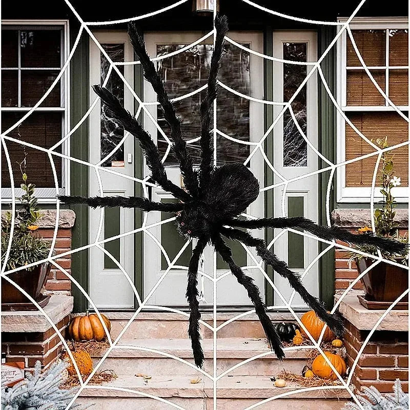 Giant Halloween spider decoration with a realistic design set against a house entrance with a web