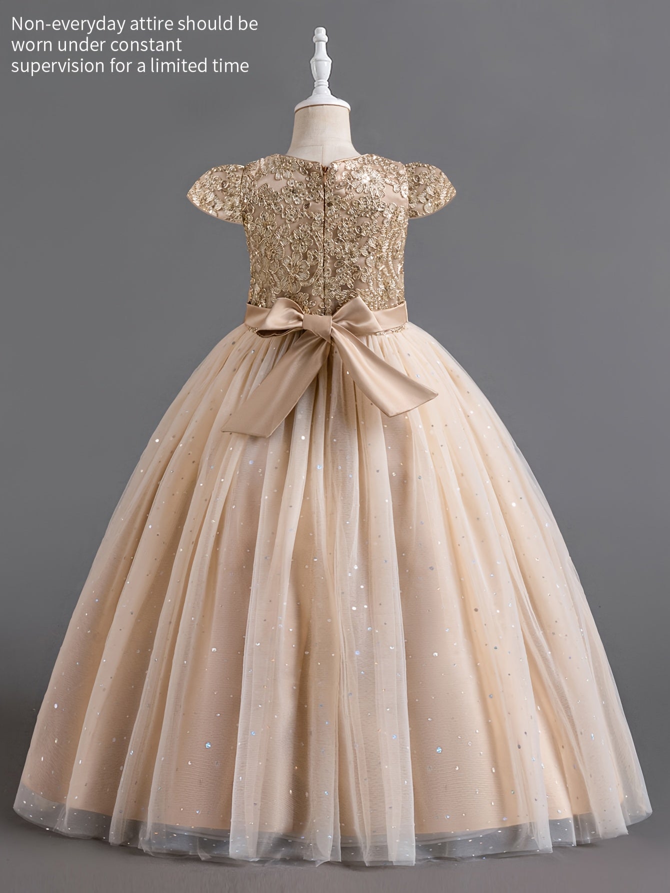 Elegant girls floral wedding dress with a gold sequin bodice and a flowing tulle skirt