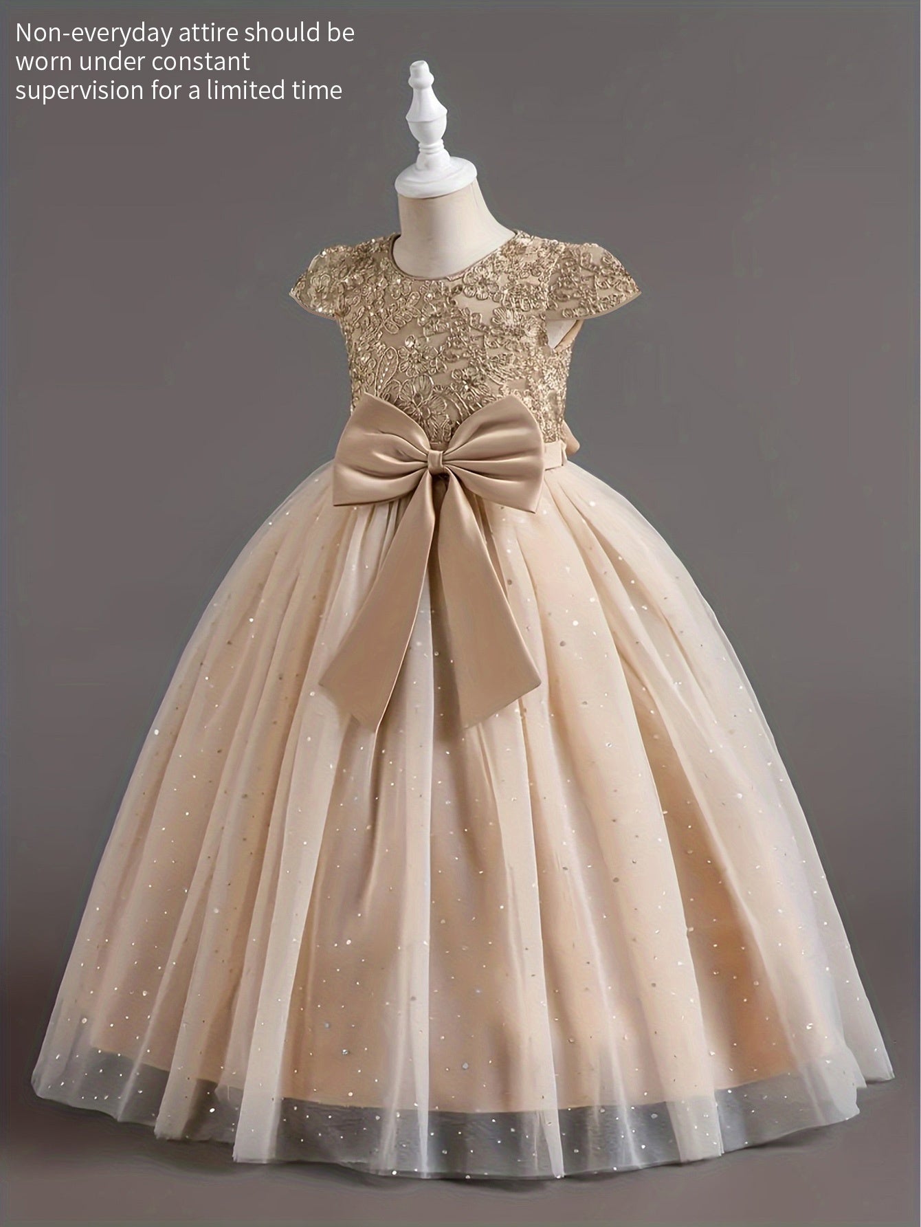 Girls floral wedding dress with a beaded bodice and a large bow at the waist for elegant occasions