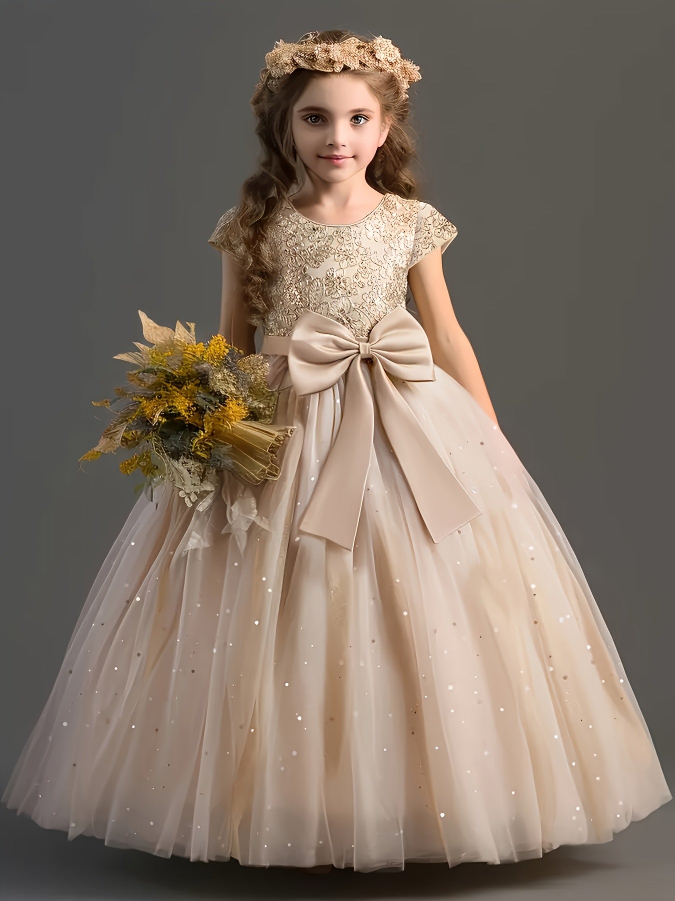 Girls floral wedding dress with a bow and sparkling details, perfect for special occasions