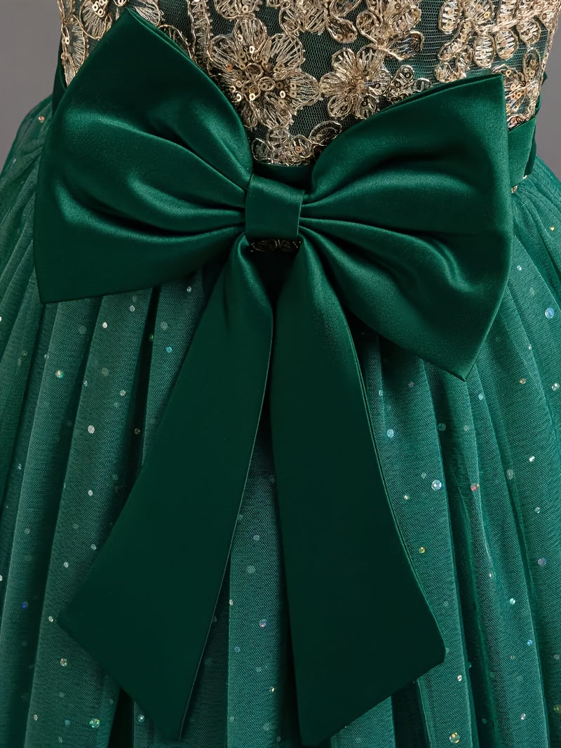 Girls floral wedding dress with a green skirt and decorative bow detail on the back