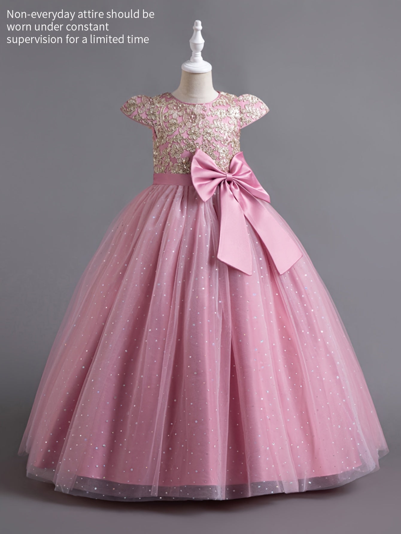 Girls floral wedding dress with cap sleeves and a large bow, perfect for special occasions