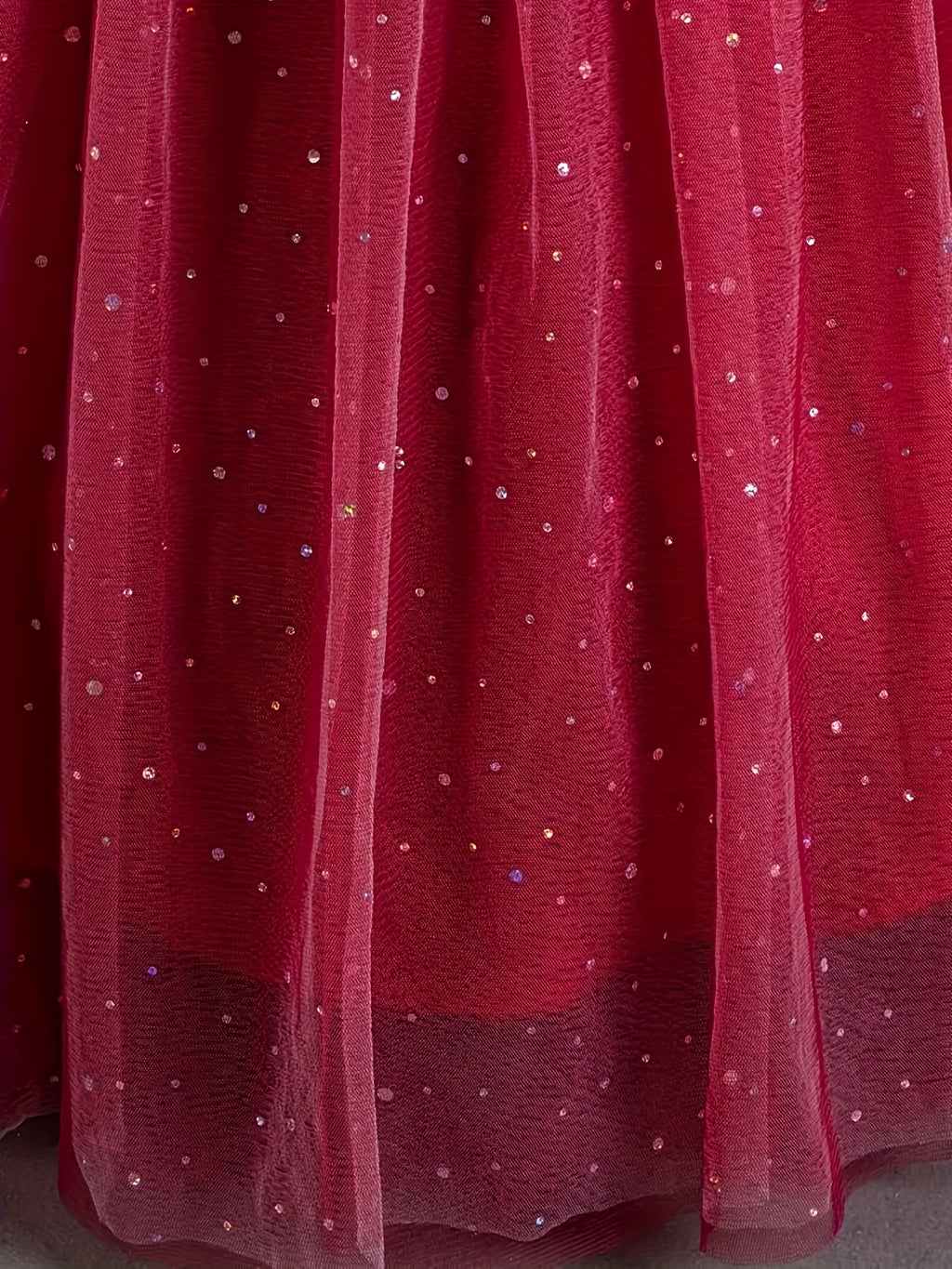 Girls floral wedding dress featuring a layered tulle skirt with sparkling sequins for a festive look