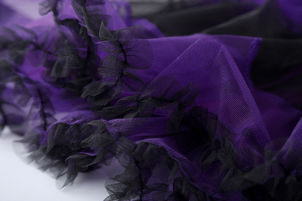 Close-up of girls purple bat costume featuring soft purple and black tulle ruffles